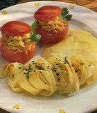 Stuffed tomatoes with cheese sauce